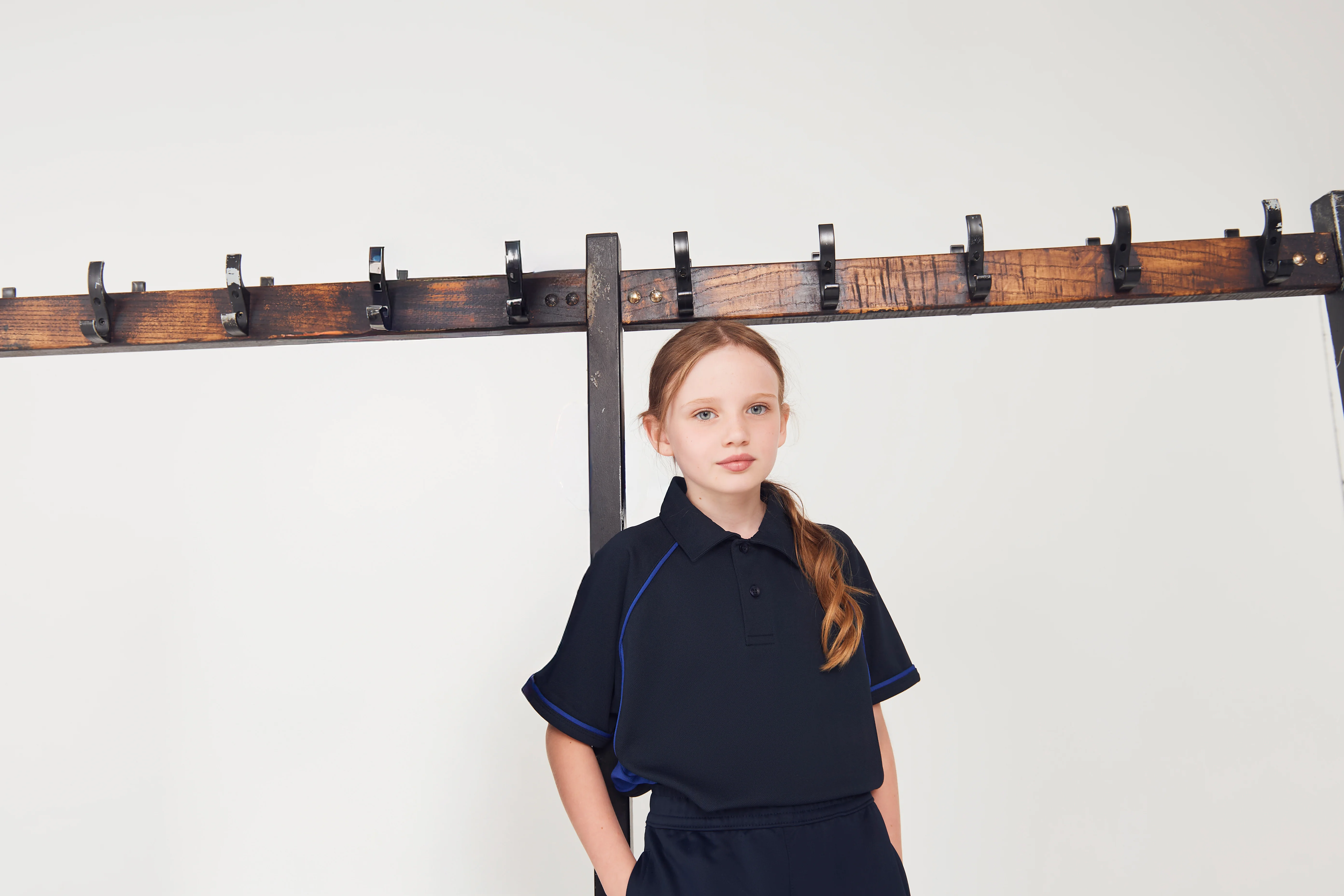 Kids piped performance polo